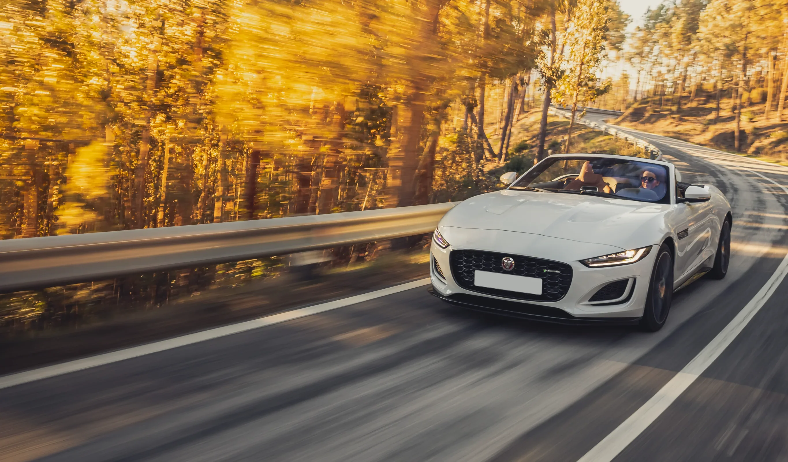 A Jaguar F-TYPE on an autumn road